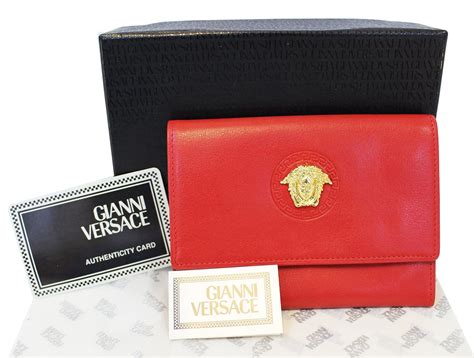 versace collection red cloutch|Versace leather wallet.